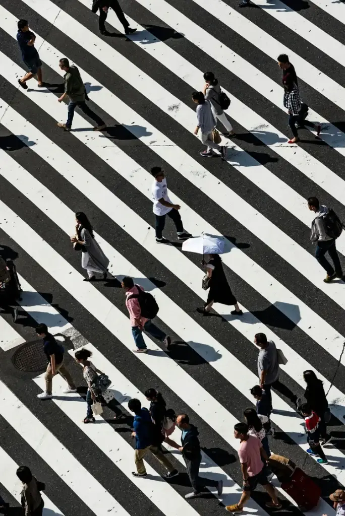 Overhead view of people crossing a busy crosswalk